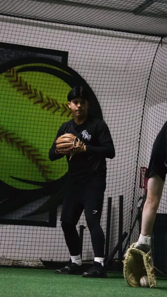 BAP player fielding during an indoor drill