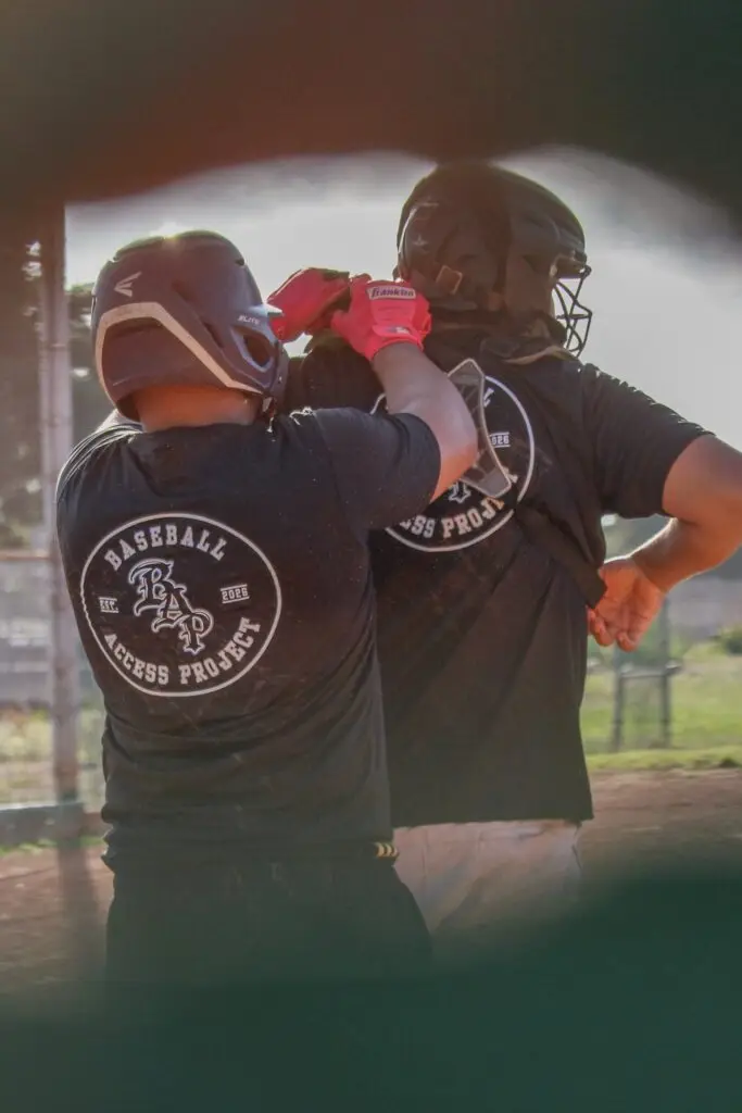 Two BAP players in batting helmets