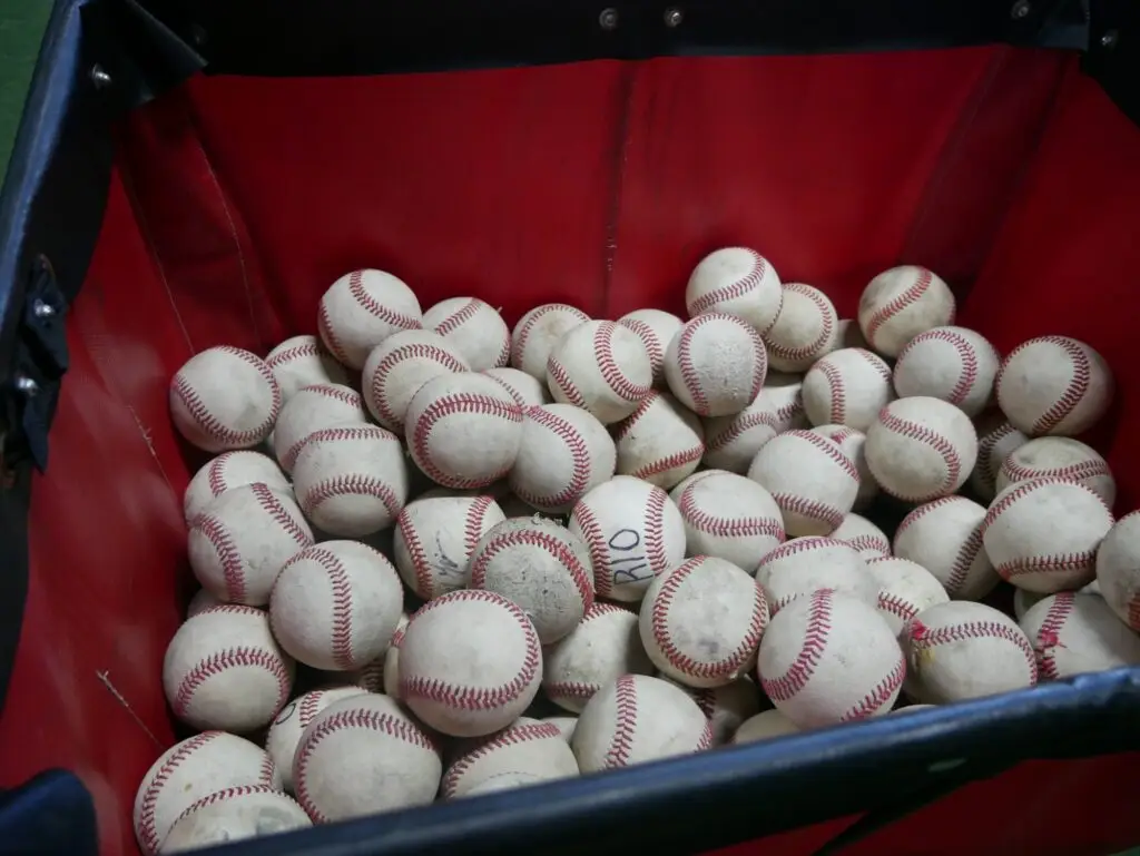 A cart full of practice baseballs
