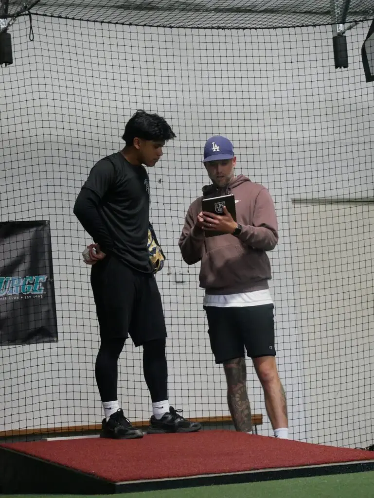 BAP coach reviewing video with a player on a tablet